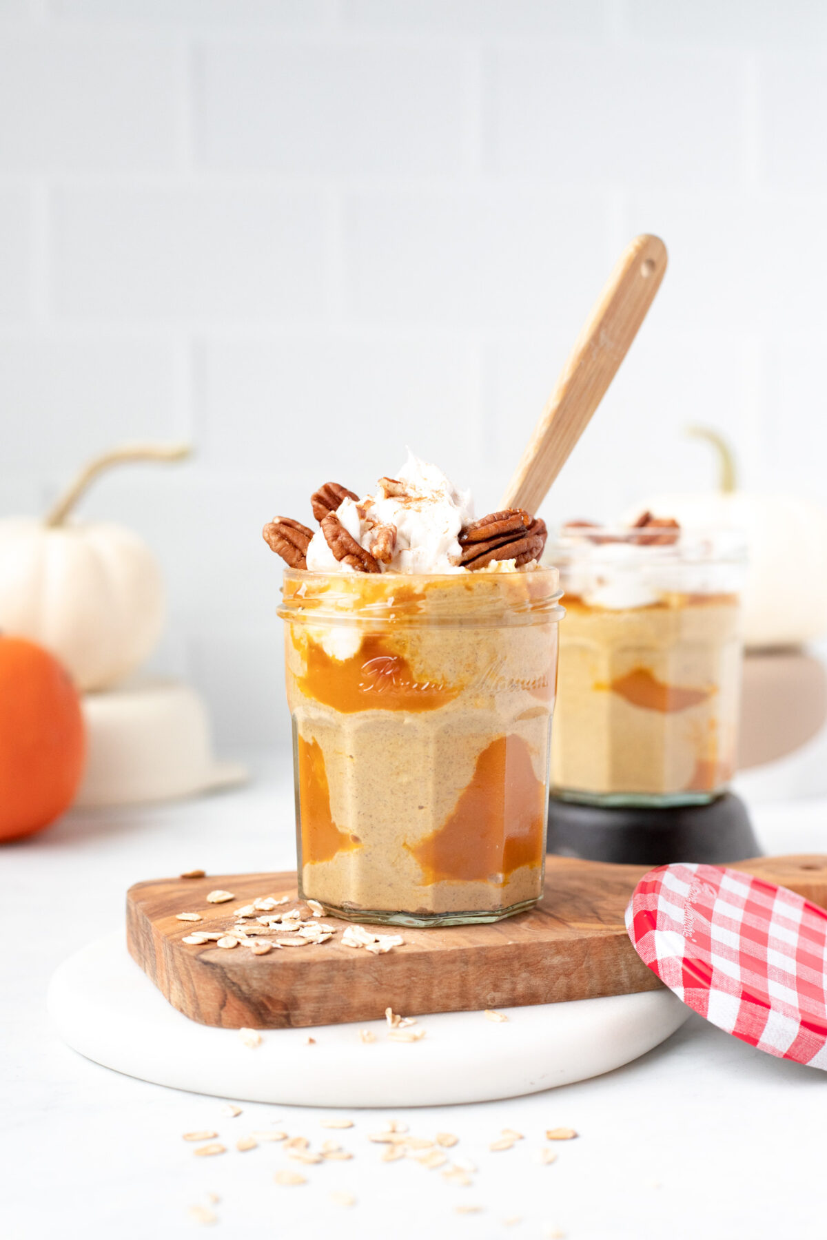 Pumpkin Pie Overnight Oats in a jar with a spoon