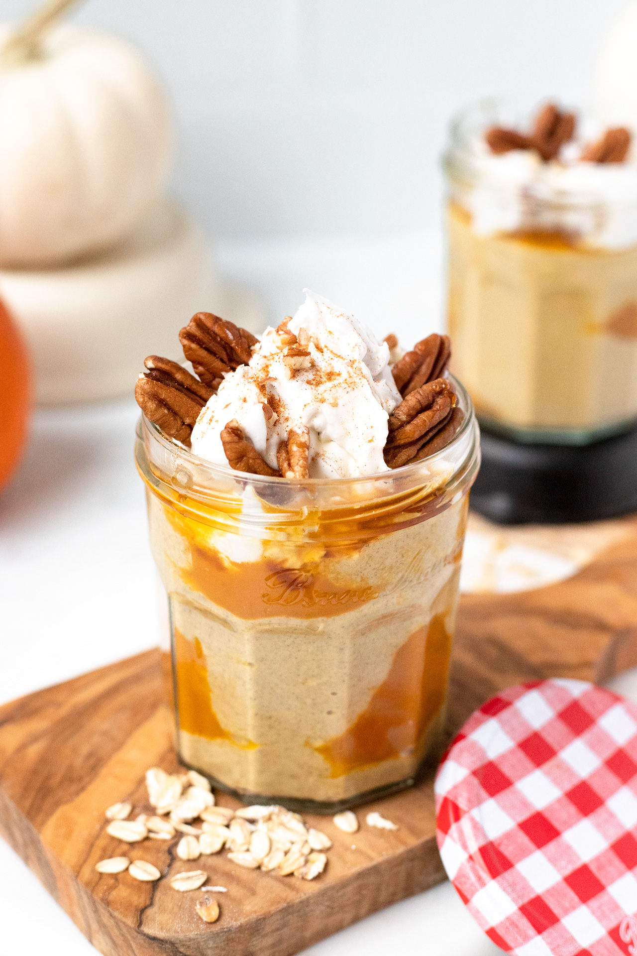 Creamy Pumpkin Pie Overnight Oats with pecans and coconut whip