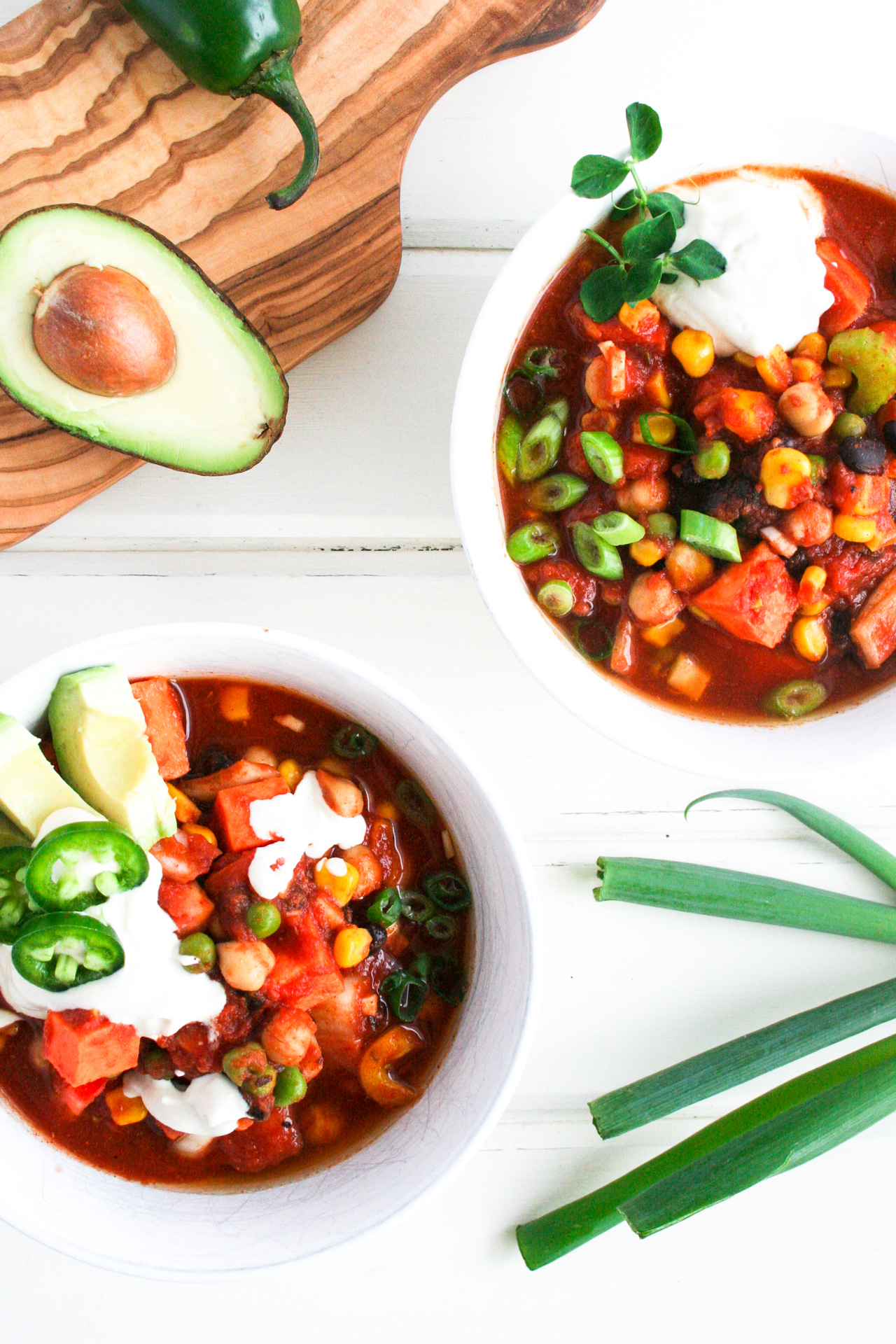 Vegan Chilli two bowls with avocado and green onion