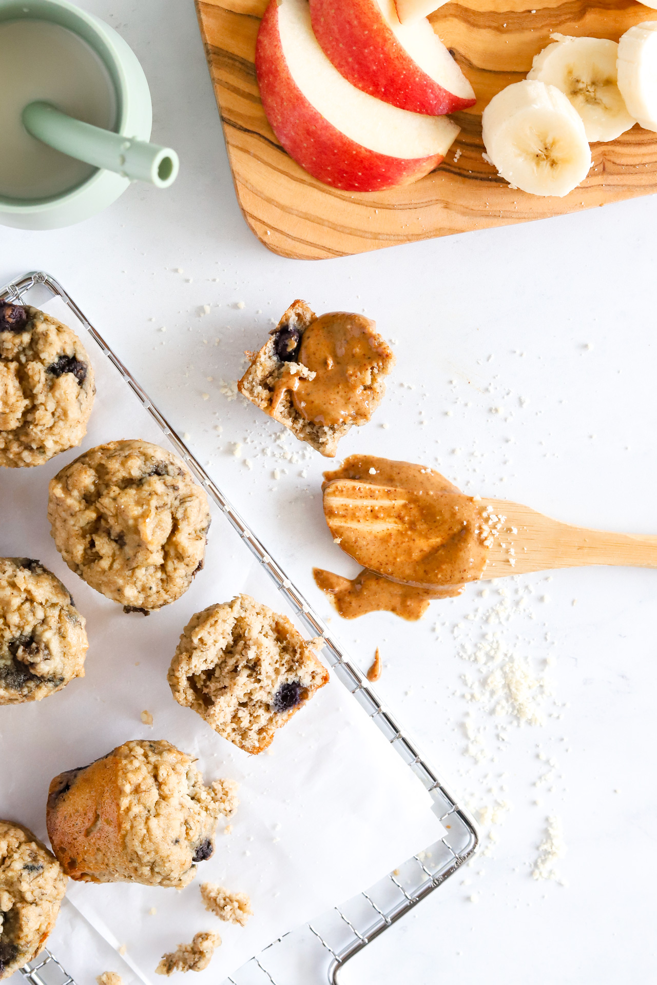 Healthy mini blueberry muffins with nut butter and apple slices